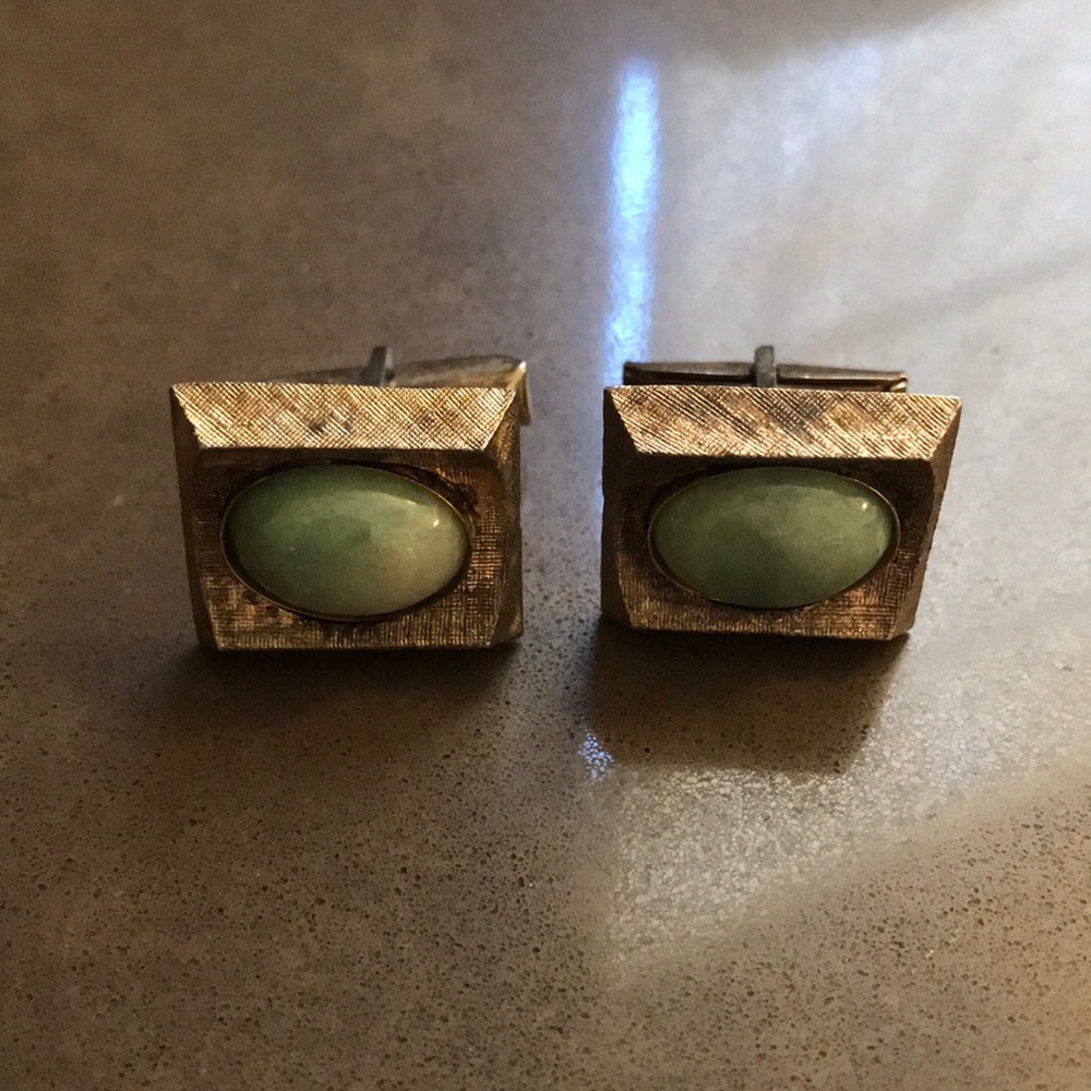 Vintage sterling cuff links with green stones.